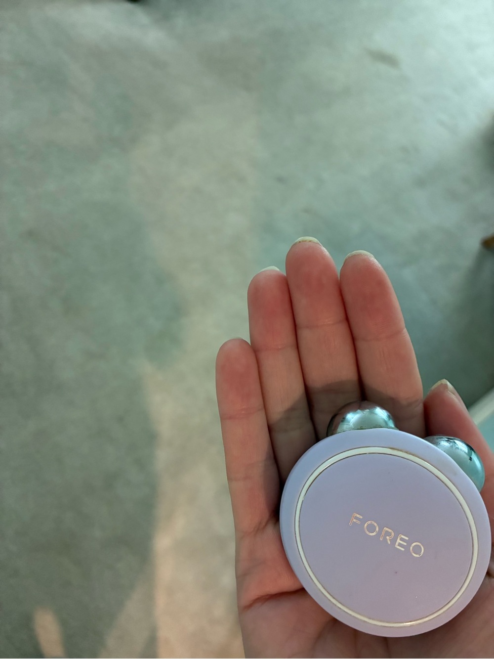 FOREO Facial Massager in Lavender and Silver - Compact Roller Tool